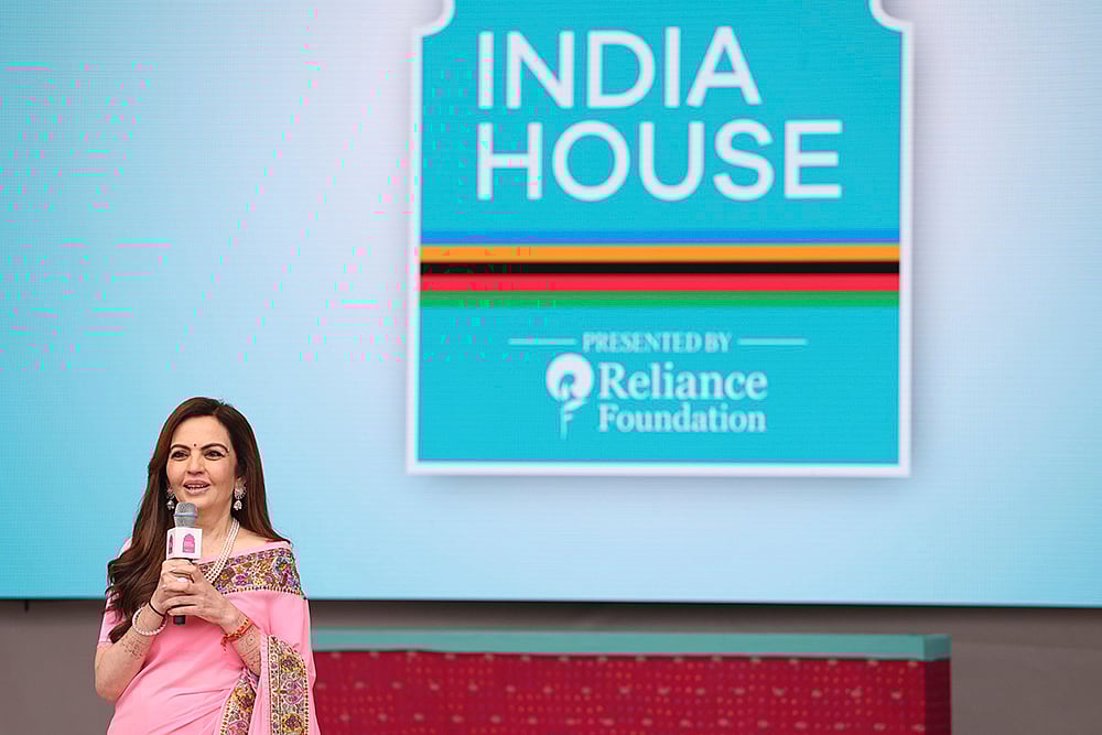 | Photo: AP/Aurelien Morissard : Nita Ambani delivers a speech